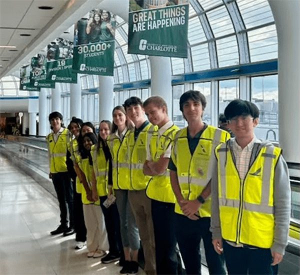 Student volunteers at the airport