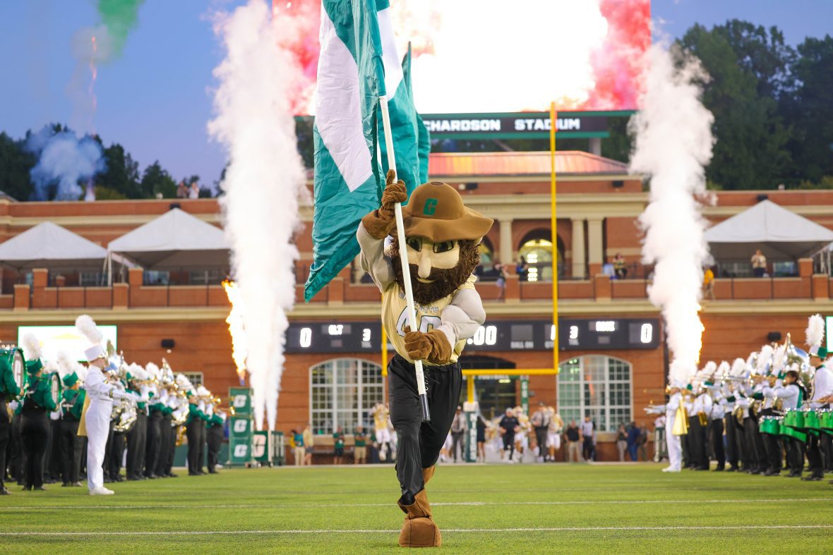 Photo of Norm running out on football field